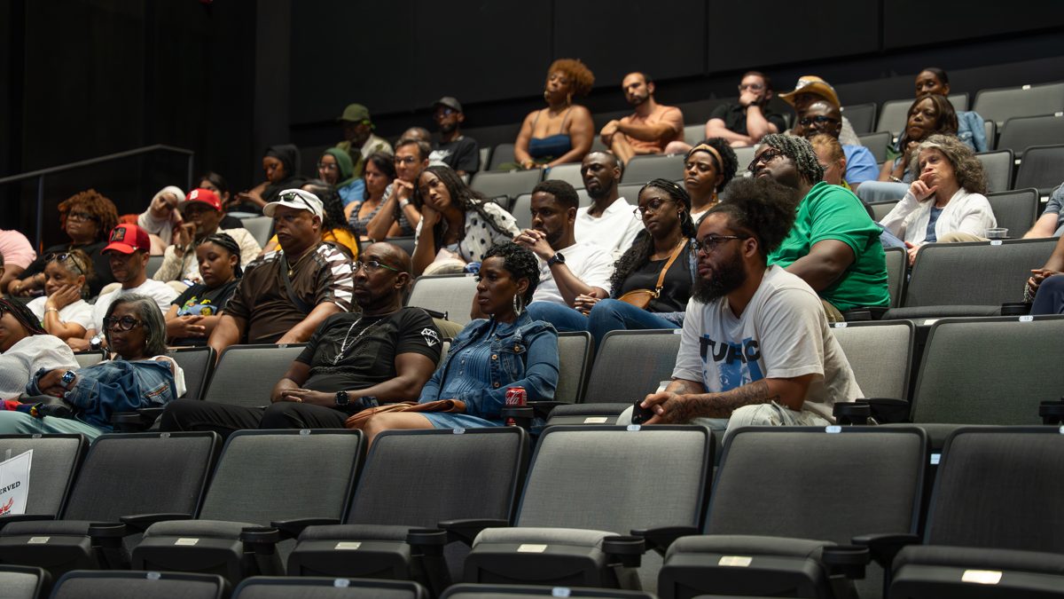 A wide view of the audience gathered for a Reels & Roots screening